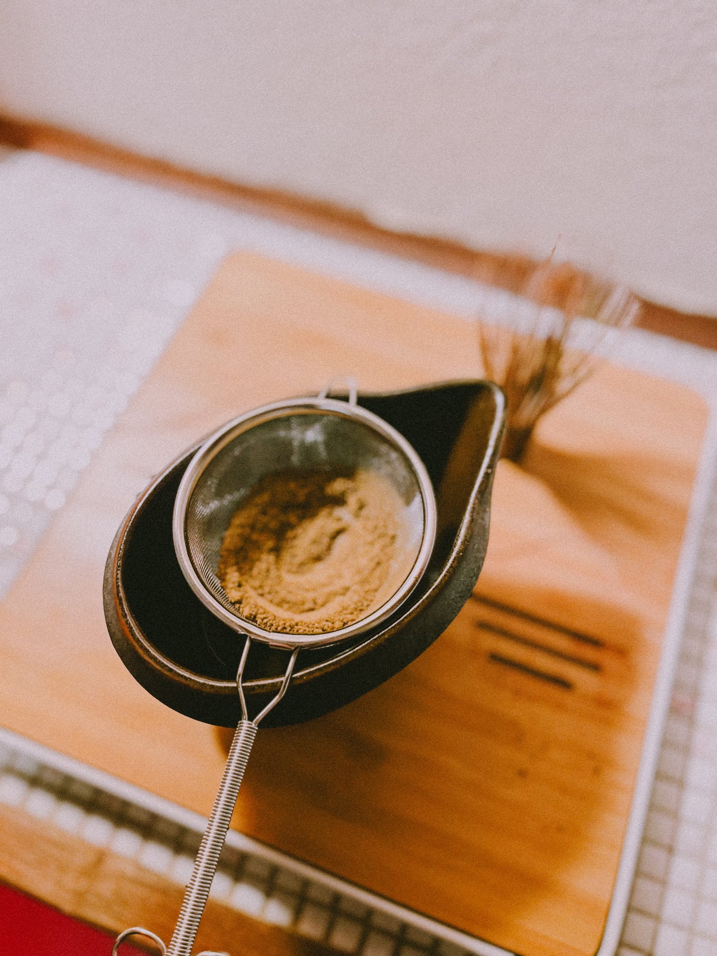 Hojicha powder on a sieve. Roasted Green Tea from Shizuoka, Japan.