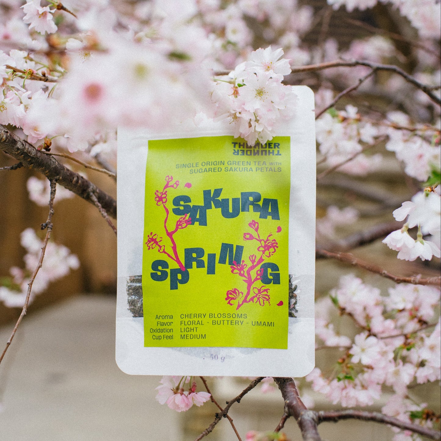 Packaging labeled 'Sakura Spring' against a cherry blossom background