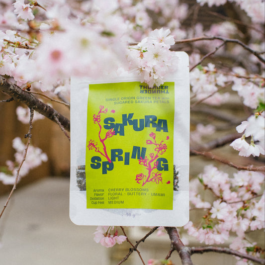 Packaging labeled 'Sakura Spring' against a cherry blossom background